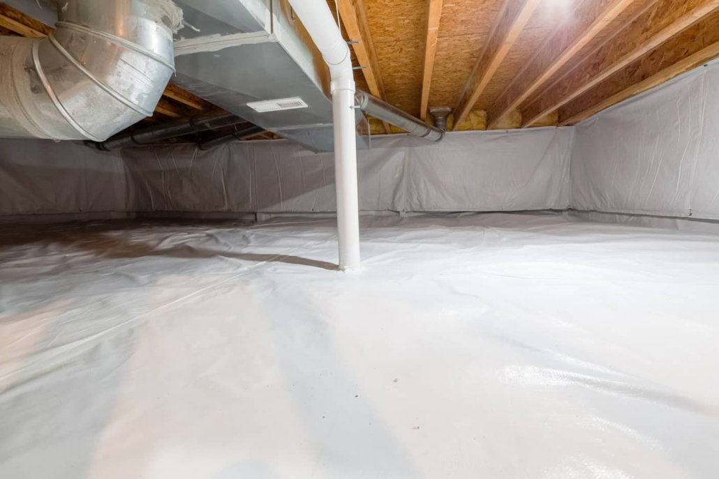 Encapsulated crawl space with vapor barrier and mitigation system pipe. 